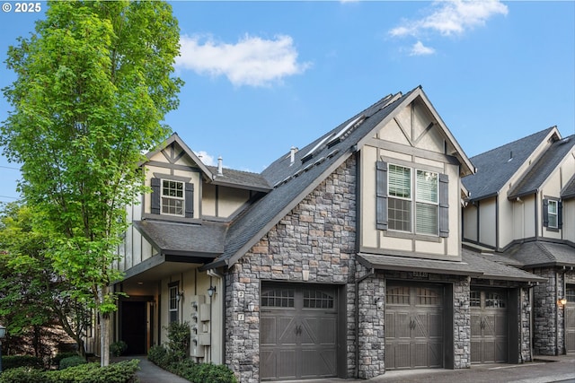 tudor house with stone siding and stucco siding