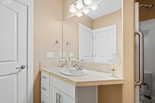 full bathroom with vanity and a shower