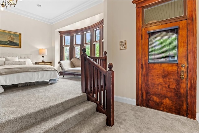 1111 NW 25th Ave Unit 1, Portland, OR 97210 - carpeted bedroom with baseboards, crown molding, and a chandelier