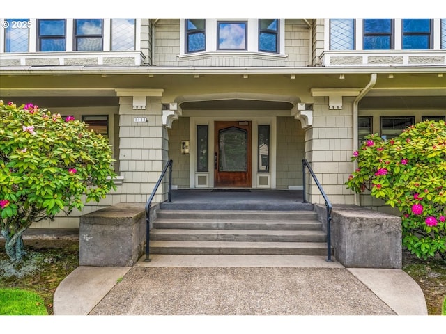 property entrance featuring a porch