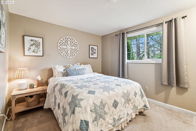 carpeted bedroom featuring a textured ceiling