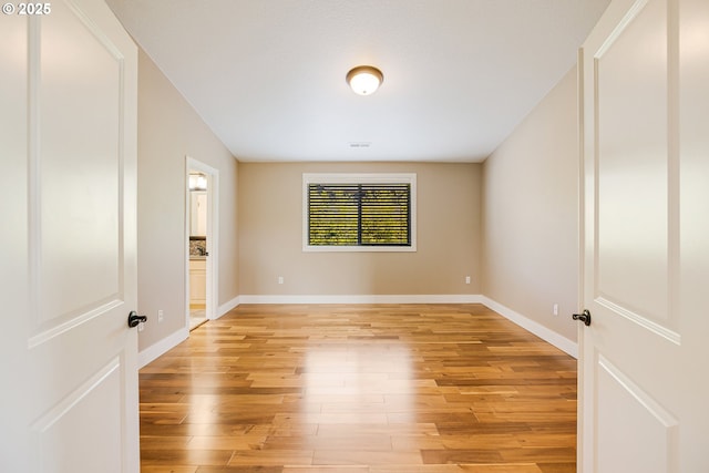 13577 SE Kisor Ct, Happy Valley, OR 97086 - spare room featuring light wood-type flooring and baseboards