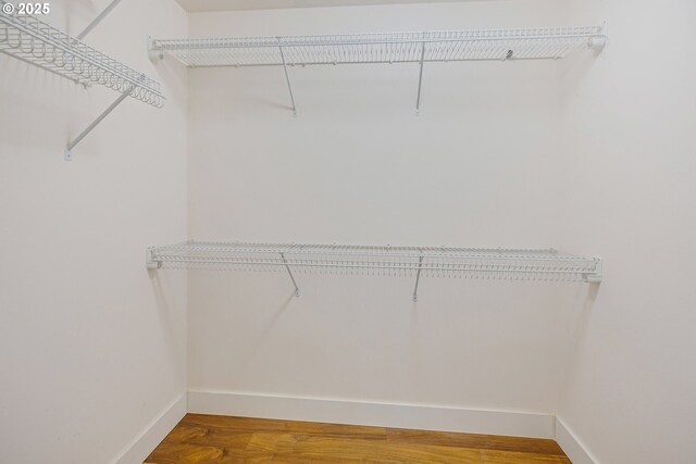 13577 SE Kisor Ct, Happy Valley, OR 97086 - walk in closet featuring wood finished floors