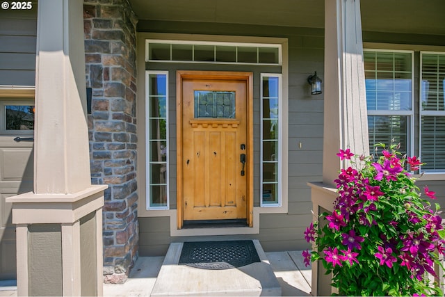 13577 SE Kisor Ct, Happy Valley, OR 97086 - view of exterior entry featuring stone siding and a porch