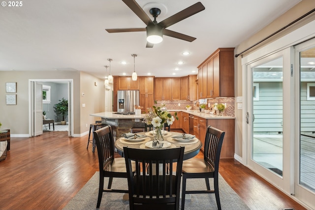 dining room with dark wood-style floors, recessed lighting, a ceiling fan, and baseboards