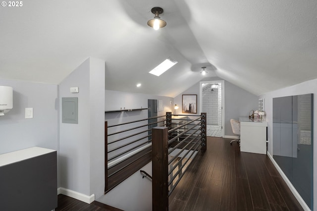 additional living space with lofted ceiling, baseboards, and wood finished floors