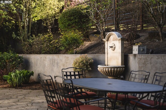 view of patio / terrace featuring outdoor dining area and fence