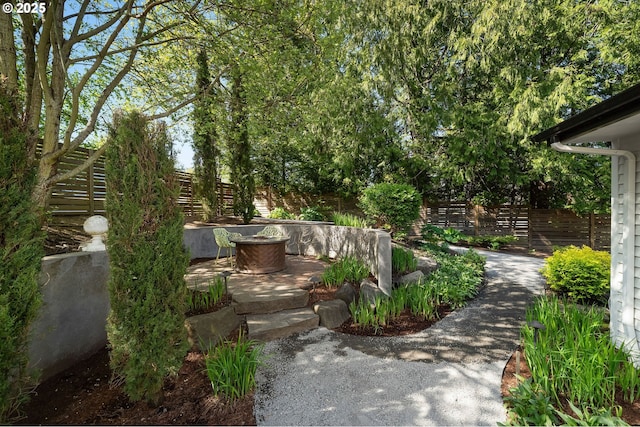 view of yard with fence and a patio area