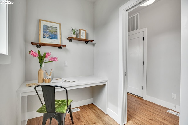 3985 SE Lostine Ln, Hillsboro, OR 97123 - office with light wood-style floors, baseboards, and built in desk