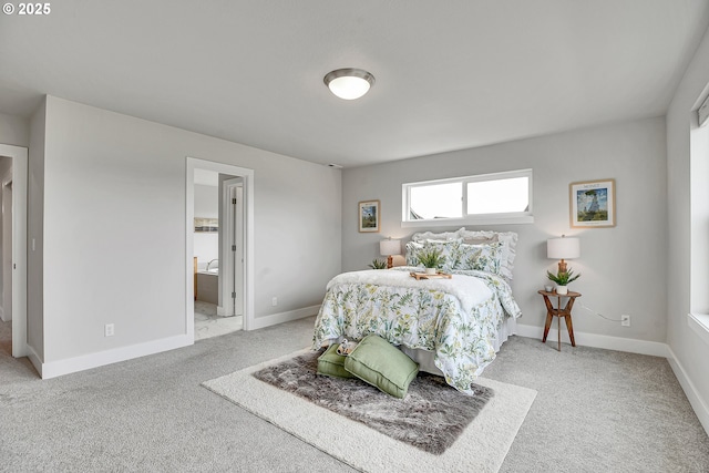 3985 SE Lostine Ln, Hillsboro, OR 97123 - carpeted bedroom featuring baseboards and ensuite bath