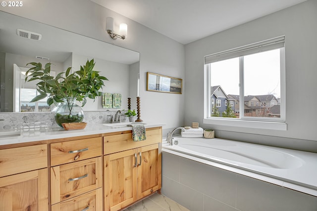 3985 SE Lostine Ln, Hillsboro, OR 97123 - bathroom with marble finish floors, double vanity, and a garden tub