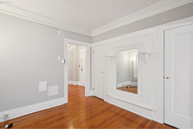 unfurnished room with wood finished floors