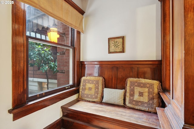 living area featuring wainscoting
