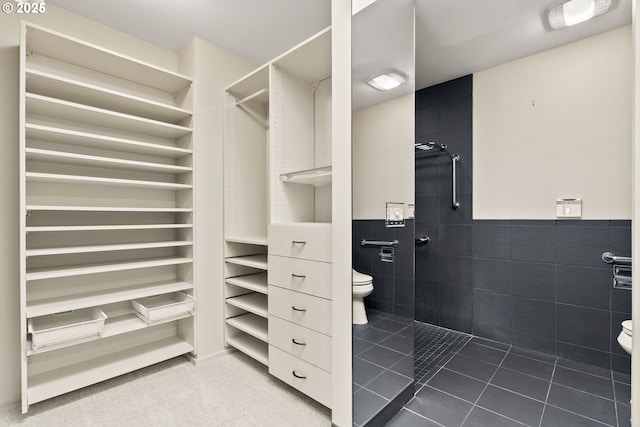 spacious closet with light tile patterned flooring