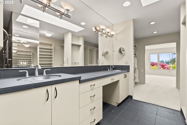 full bath featuring recessed lighting, a sink, tile patterned flooring, and double vanity