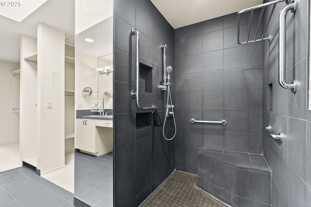 62 Condolea Ter, Lake Oswego, OR 97035 - full bath featuring tile patterned floors, tiled shower, vanity, and a spacious closet