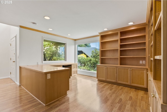 unfurnished office featuring recessed lighting, baseboards, ornamental molding, and light wood-style flooring
