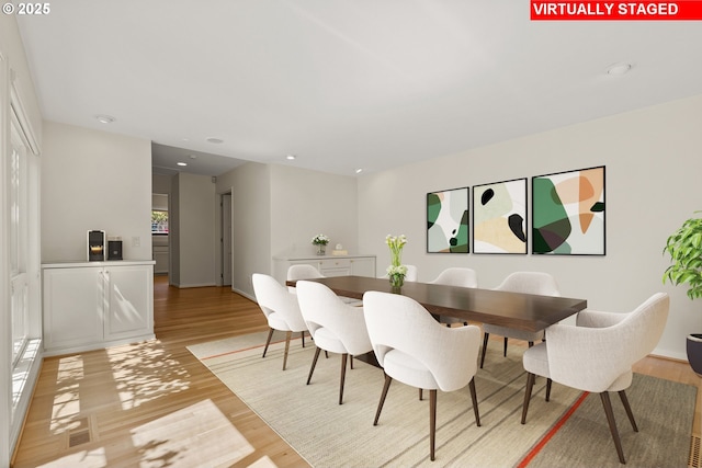 dining area featuring recessed lighting and light wood-type flooring