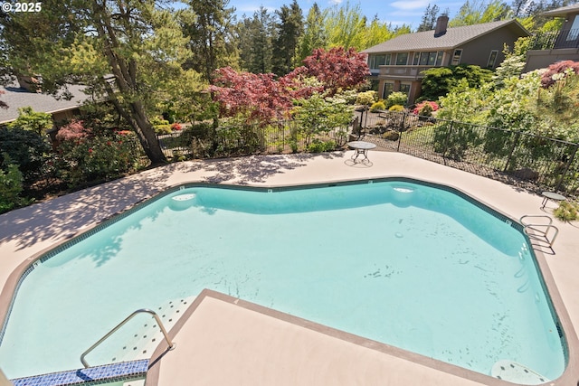 view of pool with fence and a fenced in pool