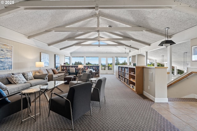 tiled living area with baseboards, vaulted ceiling with beams, and a ceiling fan