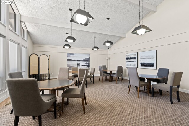 carpeted dining room with baseboards, lofted ceiling with beams, and a textured ceiling