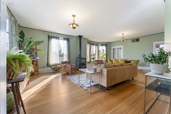 1508 Union Ave, North Bend, OR 97459 - living area with wood finished floors and a wood stove