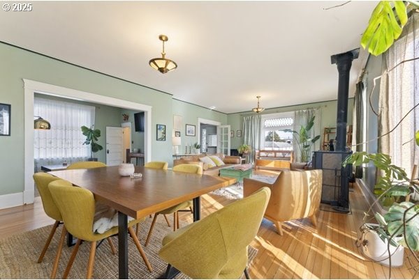 1508 Union Ave, North Bend, OR 97459 - dining area featuring a wood stove and wood finished floors