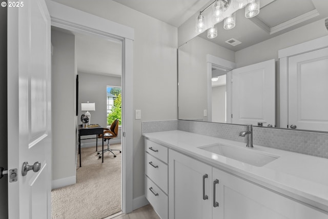 bathroom with visible vents, baseboards, and vanity