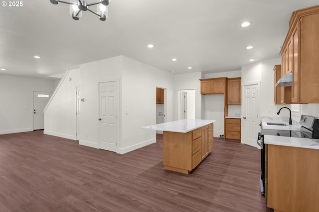 48438 E Meadow Way, Oakridge, OR 97463 - kitchen with stainless steel electric range, a center island, dark wood-style flooring, under cabinet range hood, and recessed lighting