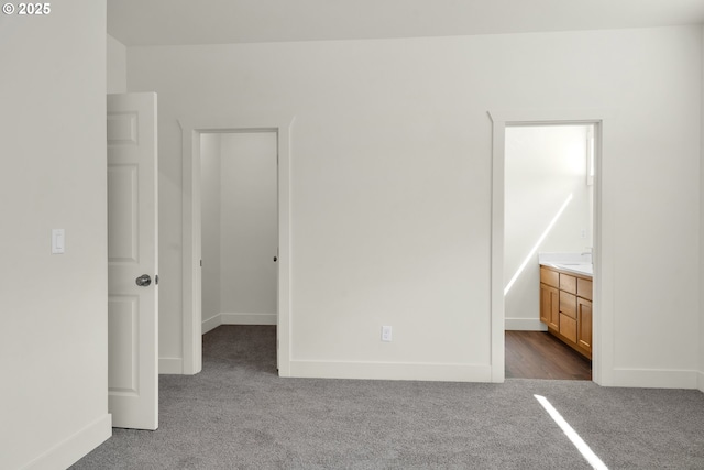 48438 E Meadow Way, Oakridge, OR 97463 - unfurnished bedroom featuring carpet flooring, a walk in closet, and ensuite bathroom