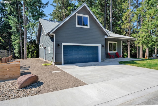 48438 E Meadow Way, Oakridge, OR 97463 - view of front of property with a garage, a metal roof, and concrete driveway