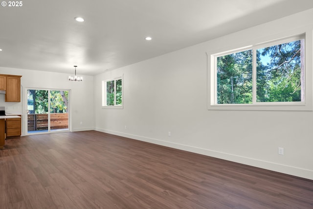 48438 E Meadow Way, Oakridge, OR 97463 - unfurnished living room with a chandelier, dark wood-style floors, and recessed lighting