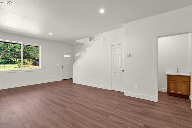 48438 E Meadow Way, Oakridge, OR 97463 - unfurnished living room with wood finished floors and recessed lighting