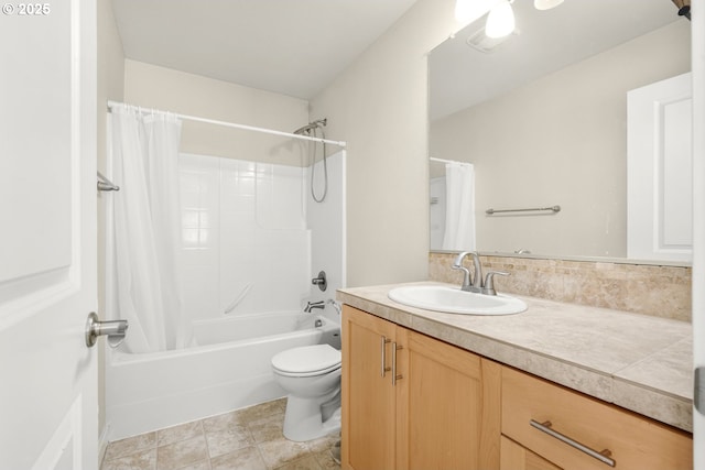 bathroom with vanity, shower / tub combo with curtain, and toilet