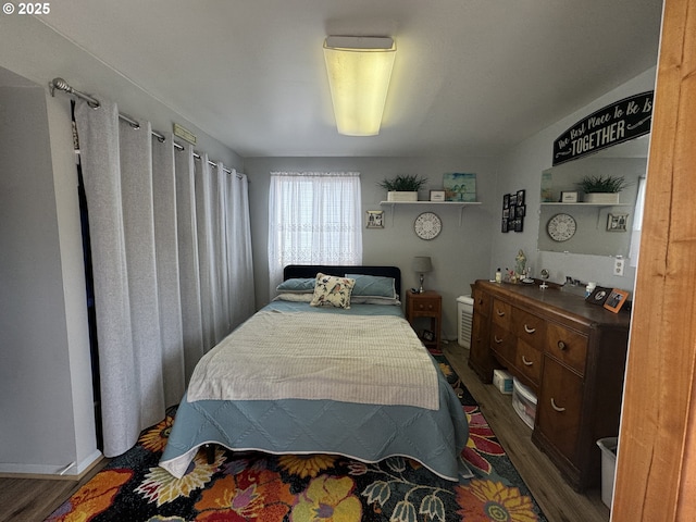 bedroom featuring wood finished floors