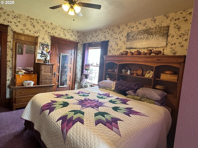 carpeted bedroom featuring wallpapered walls and ceiling fan