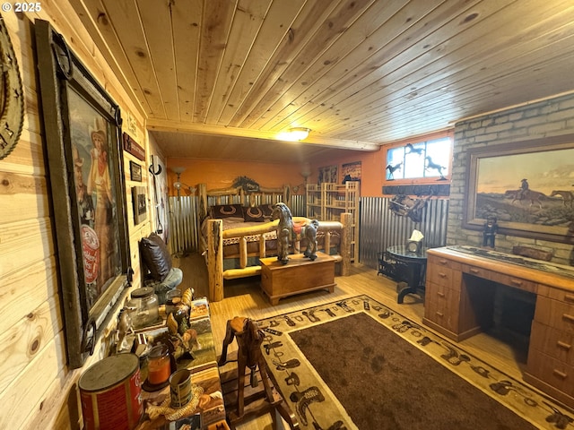 interior space featuring brick wall, wood ceiling, and wood finished floors