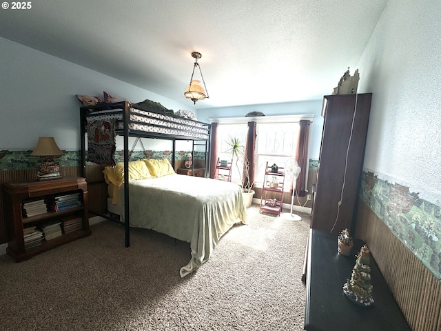 bedroom with a textured ceiling and carpet floors