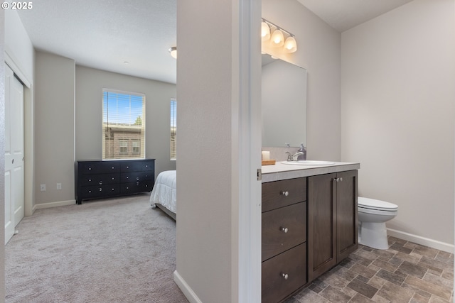 11449 SW Mont Blanc St, Wilsonville, OR 97070 - bathroom with vanity, baseboards, and toilet