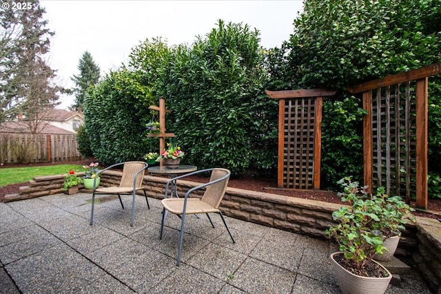 view of patio / terrace featuring fence