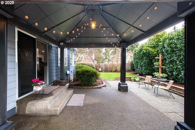 view of patio featuring fence