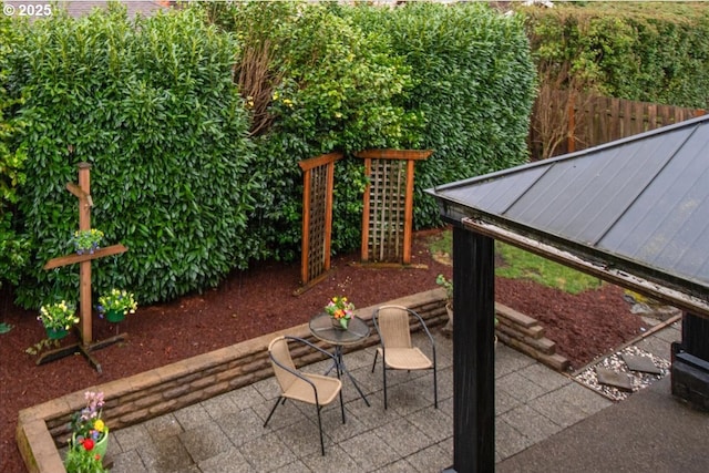 view of patio featuring fence