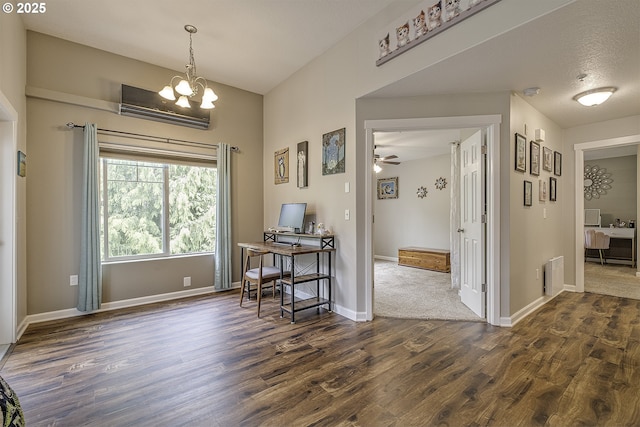 office space featuring dark wood-type flooring, baseboards, and a wall unit AC