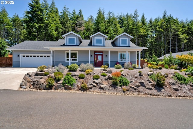 83591 Sauter Dr, Florence, OR 97439 - view of front of property with a garage, concrete driveway, and a porch