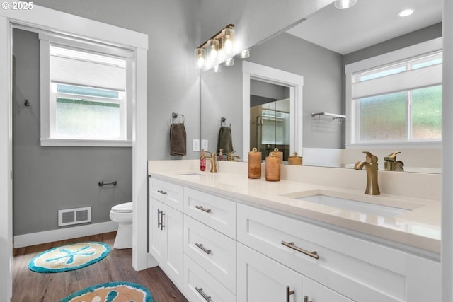 83591 Sauter Dr, Florence, OR 97439 - full bathroom with double vanity and wood finished floors