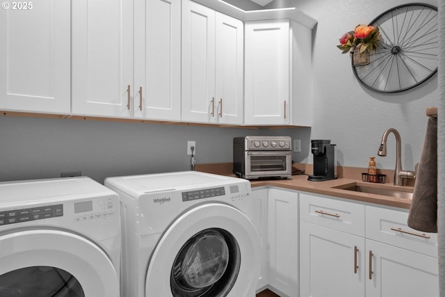 83591 Sauter Dr, Florence, OR 97439 - laundry room with washer and clothes dryer and cabinet space