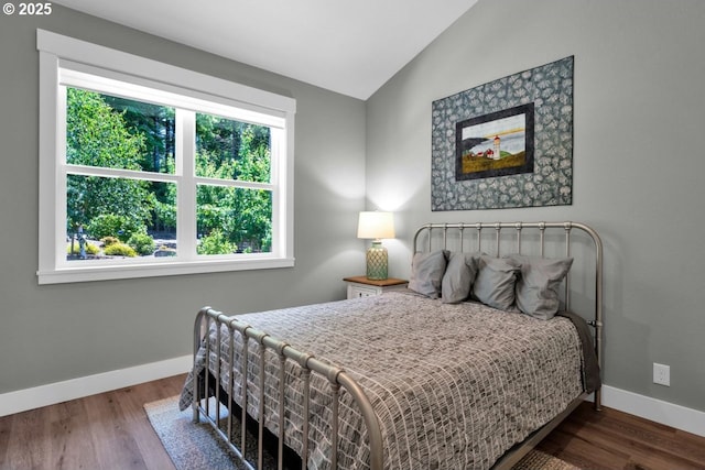 83591 Sauter Dr, Florence, OR 97439 - bedroom featuring lofted ceiling and wood finished floors