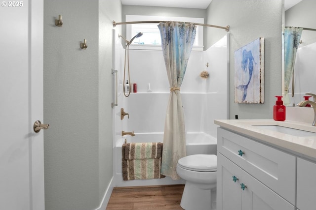 83591 Sauter Dr, Florence, OR 97439 - bathroom featuring vanity, wood finished floors, shower / bath combination with curtain, and a textured wall