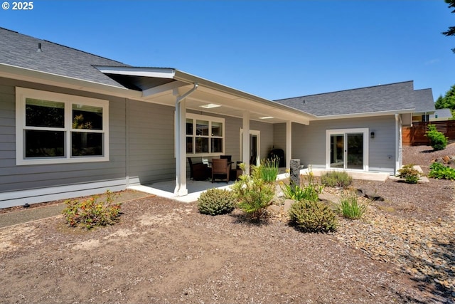 83591 Sauter Dr, Florence, OR 97439 - rear view of house with a patio and roof with shingles