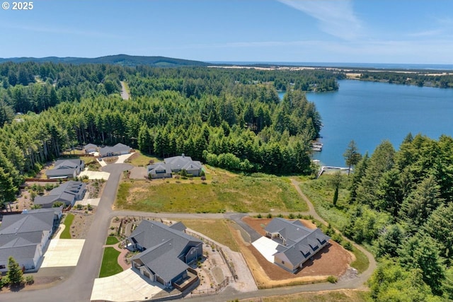83591 Sauter Dr, Florence, OR 97439 - aerial perspective of suburban area featuring a forest and a nearby body of water